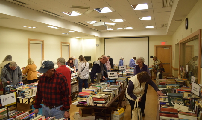 The 12th annual Book and Media Swap brought hundreds of residents to the Chatham Town Hall Annex Saturday and Sunday, where thousands of books, DVDs, VHS tapes and other media found new homes. Just about every literary genre was represented in the stacks of hardcover and paperbacks, and piles of DVDs and VHS movies offered hours of browsing to the curious. Puzzles and vinyl records were also available. The event is sponsored by Chatham Recycles, which received help from a cadre of volunteers and members of AmeriCorps Cape Cod. TIM WOOD PHOTOS