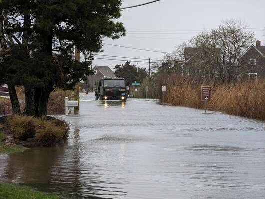Chatham’s high water vehicle makes it through flooding on Morris Island Road. ALAN POLLOCK PHOTO