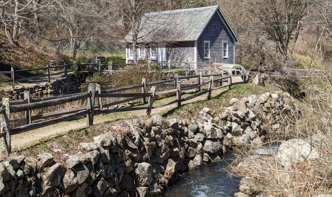 The stone wall that separates the Stony Brook mill headrace pond (left) from the brook has begun to slump and is targeted for repairs.  ALAN POLLOCK PHOTOS