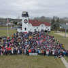 Revelers gathered at the Coast Guard Station for the traditional town photo. SPENCER KENNARD PHOTO