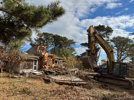 Demolition began Monday on three homes on Sipson Island, part of an effort by the Sipson Island Trust to return the island to its natural state. PHOTO COURTESY DIANA LANDAU