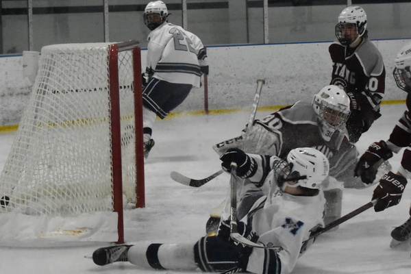 Monomoy freshman Max Cronen scores a sliding game-tying goal with 8:34 remaining in Saturday’s 6-5 loss to Bishop Stang at Tony Kent Arena. BRAD JOYAL PHOTOS