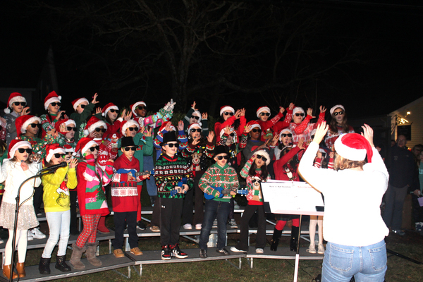 The Harwich Elementary School chorus performs "Rocken' Around The Christmas Tree" during the tree lighting  ceremony in Doane Park.