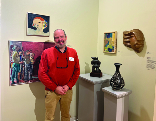 Benton Jones, director of art at the Cape Cod Museum of Art with the museum’s current exhibit Familial
