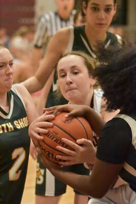 Cape Tech sophomore Gianna Lubash fights for a loose ball amid a crowd of players.