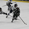 DY/CCT/CCA forward Elijah Naoom stick handles the puck after skating past two Sandwich players during Thursday’s game at Gallo Ice Arena. BRAD JOYAL PHOTOS