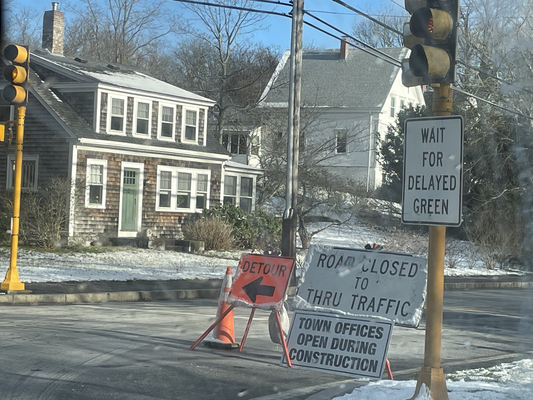 Signs such as this one at the intersection of Main Street and Tonset Road have caused some confusion for motorists as the town works to install sewer piping along Main Street in East Orleans .  RYAN BRAY PHOTO