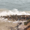 Waves crash over a revetment on Morris Island. TIM WOOD PHOTO