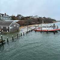 Flood waters once again inundated the Chatham Fish Pier's north jog. TIM WOOD PHOTO