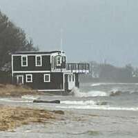 The high tide nearly surrounded this boathouse north of the Cow Yard landing. TIM WOOD PHOTO