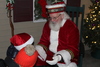 Santa enjoys a chat with a youngster during the Christmas in Harwich stroll.