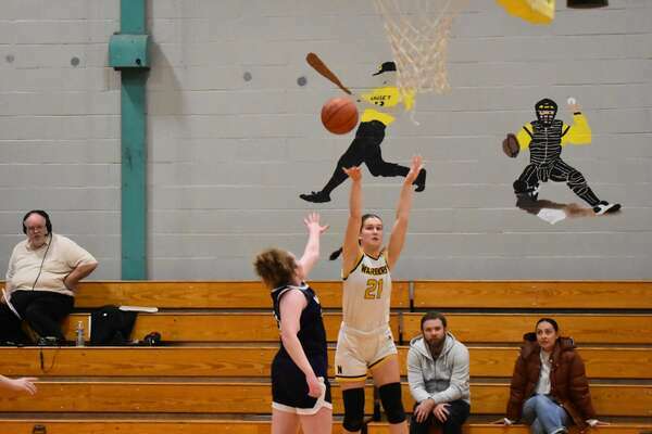 Nauset senior Gabby Foster fires a 3-pointer from the corner.