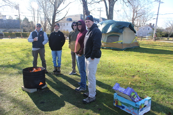 Harwich Fire Department members (left to right) Eric Diamond, Ryan Edwards, Andrew Ottino, Brandon Ferro and Scott Tyldesley  were guarding  the camp in Brooks Park  last year during the Homeless for the Holidays fundraiser, FILE PHOTO