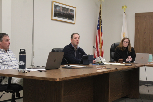 Select Board member Jeffrey Handler  (center) explains his reasoning for postponing golf committee meetings in Monday's session. Select board members Michael MacAskill and board chair Julie Kavanagh  listen intently. WILLIAM F. GALVIN PHOTO